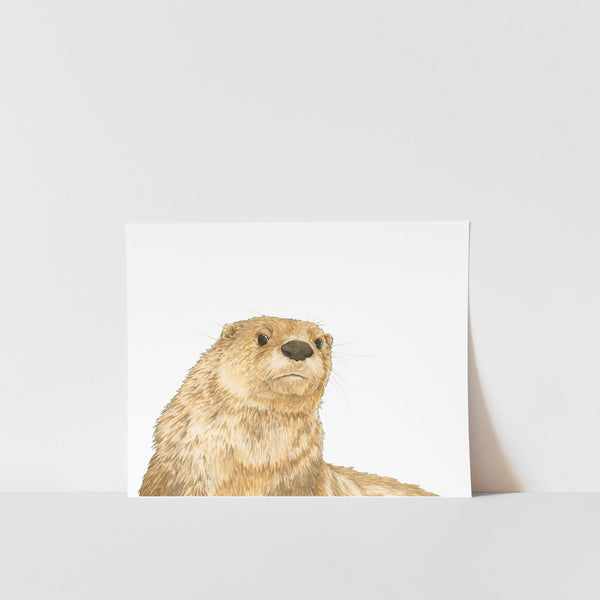 A print of an otter peeking from behind a white background, signed by artist Heather S Vitticore.