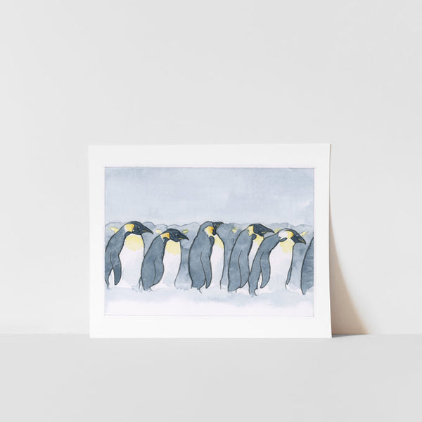 A print of a watercolor painting featuring a group of penguins on a white background, presented against a white background.